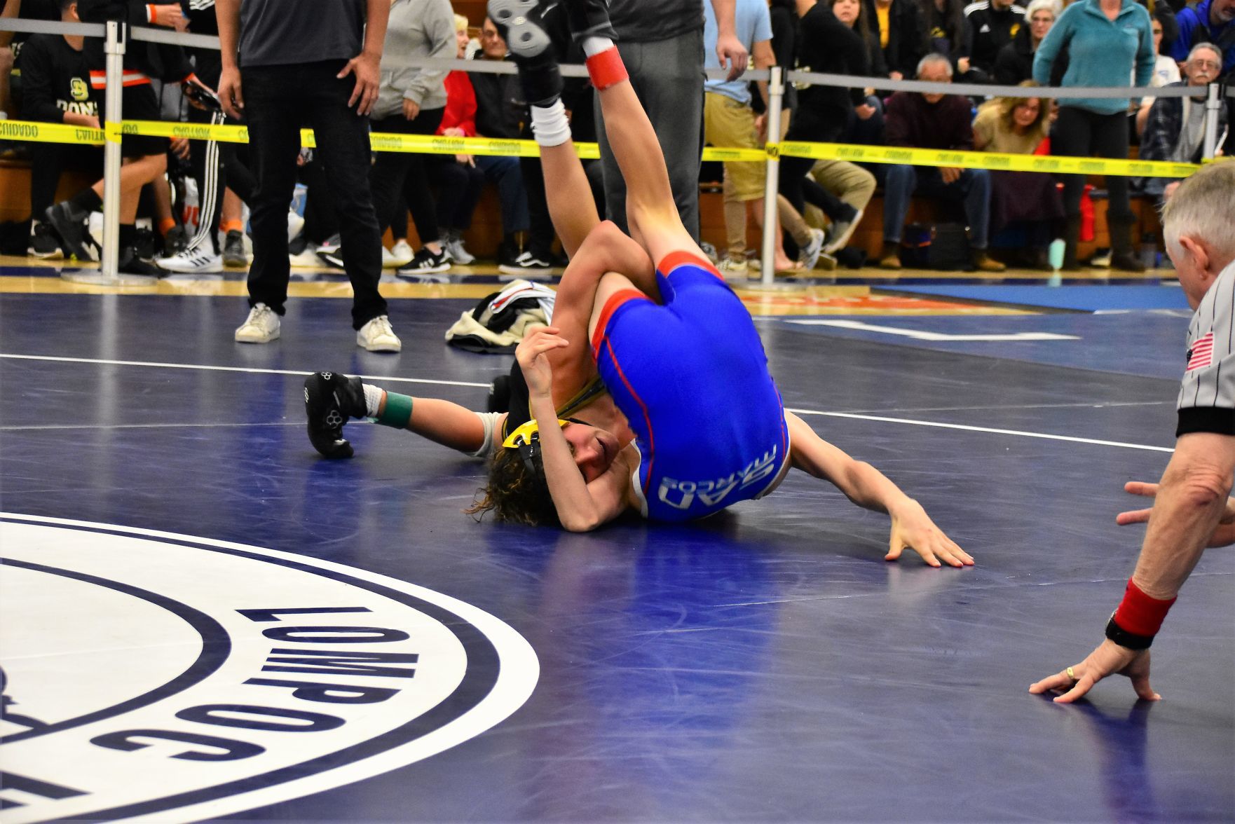 Cabrillo's Aiden Bumanglag (Bottom) tries to pin San Marcos' Levi Cooper